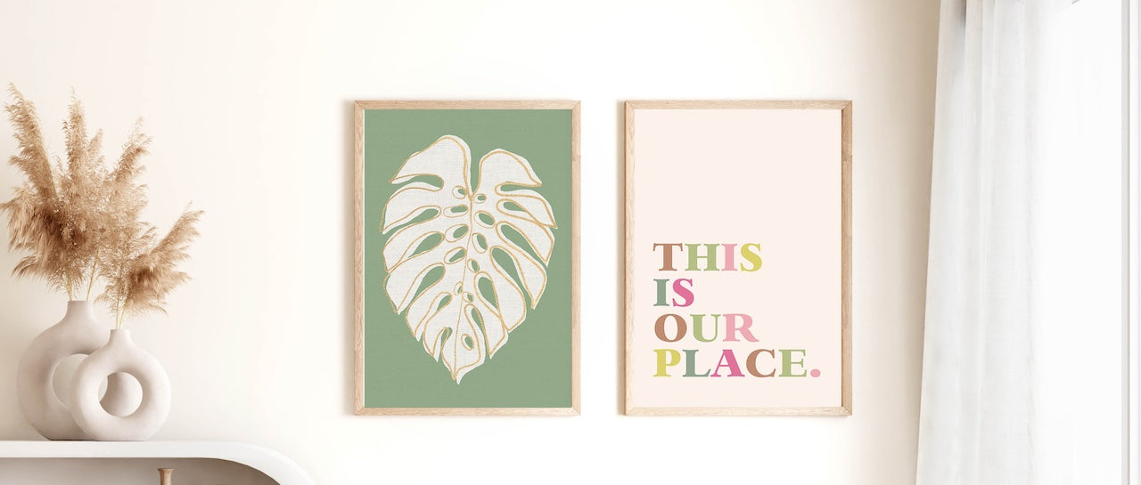 Colourful graphic wall art and botanical framed prints in a neutral living room.