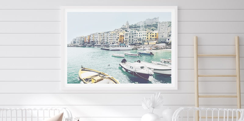 Photography Wall Art of fishing boats in a coastal town.