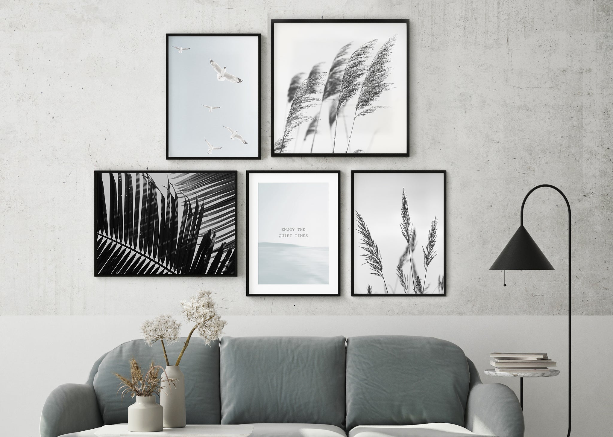 Black, white and grey gallery wall with nature inspired prints.