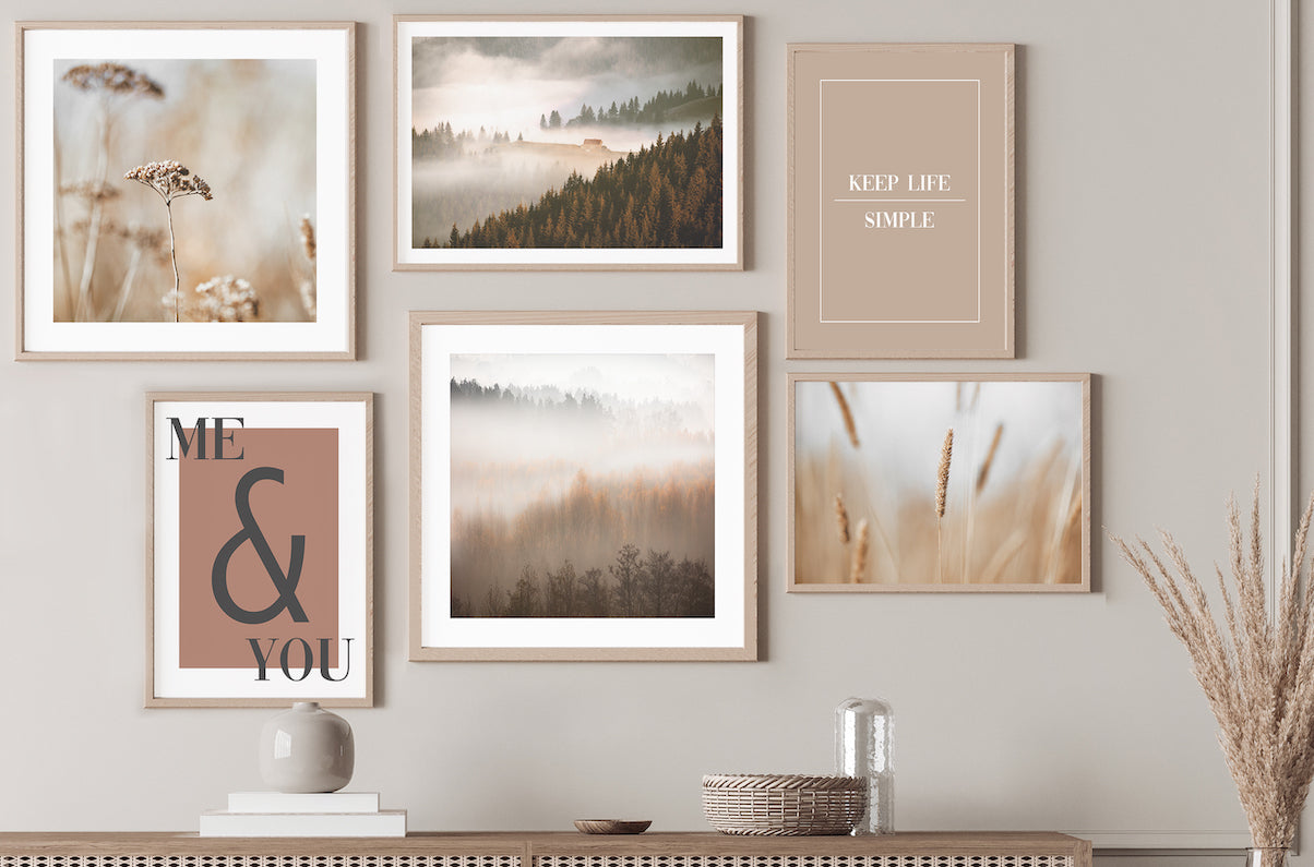 Nature wall art gallery wall in neutral dining room.
