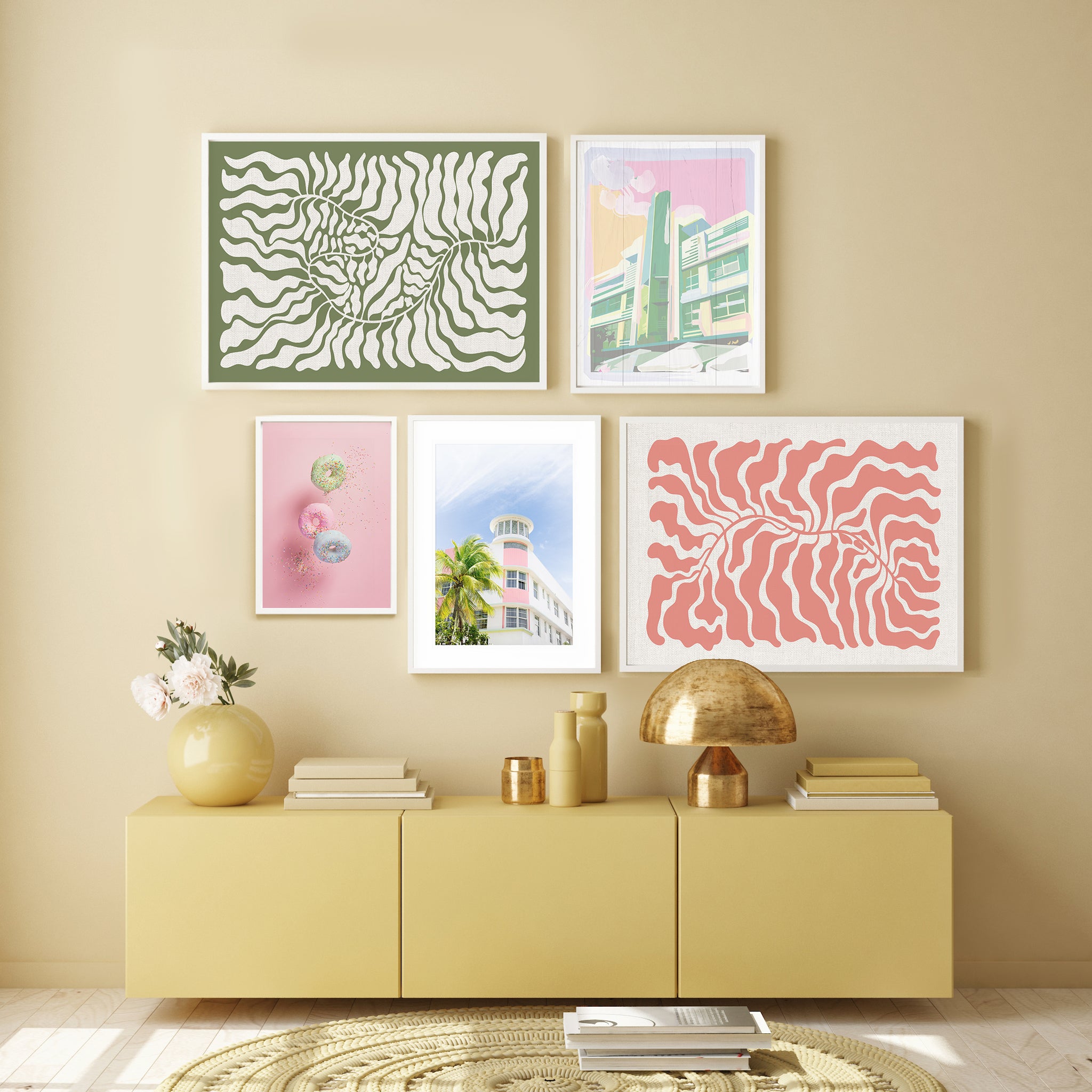 Pastel coloured gallery wall in yellow bedroom.