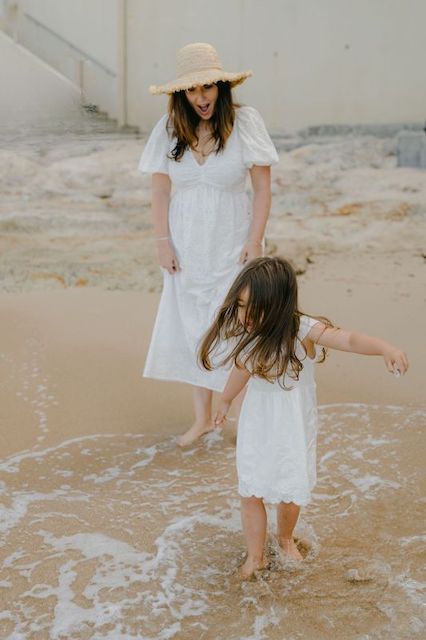 Ellisimo's founder Lauren Chopra playing on the beach with her family.