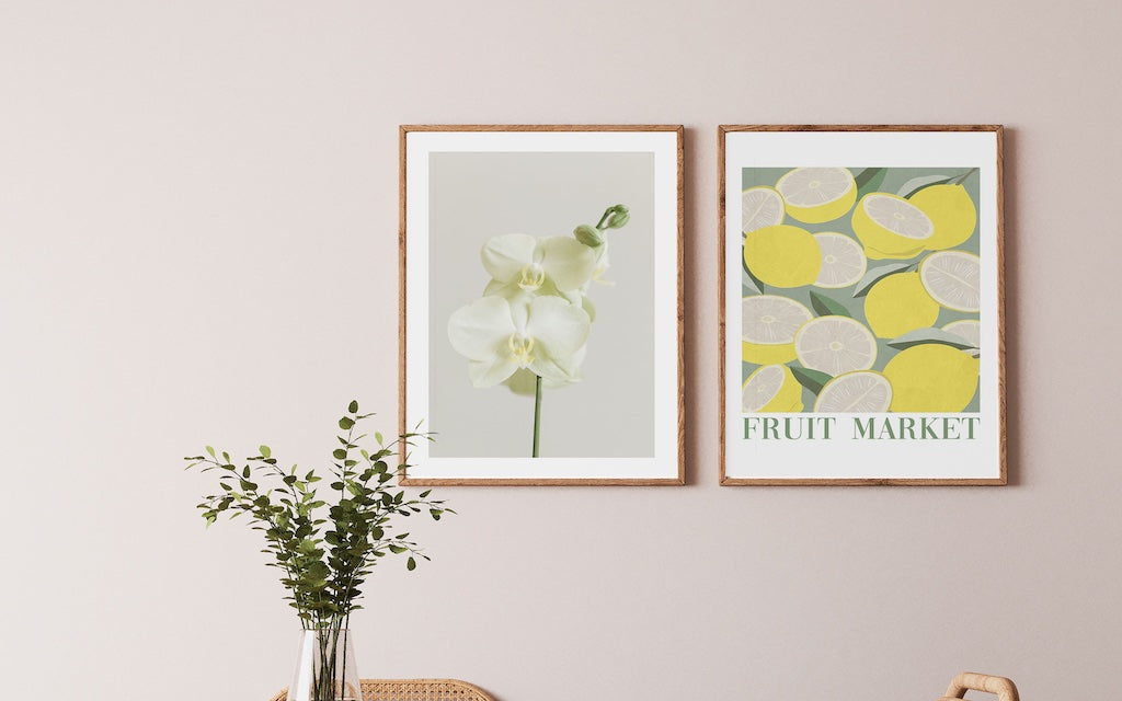 Lemon and orchid framed wall art in a neutral dining room 